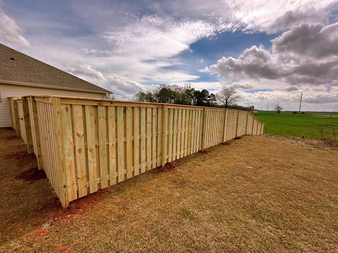 Shadow box wood fence with cap and trim
